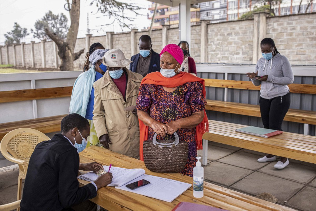 <i>Patrick Meinhardt/Bloomberg/Getty Images</i><br/>Residents wait in line to register for the AstraZeneca Covid-19 vaccine at Mbagathi Hospital in Nairobi