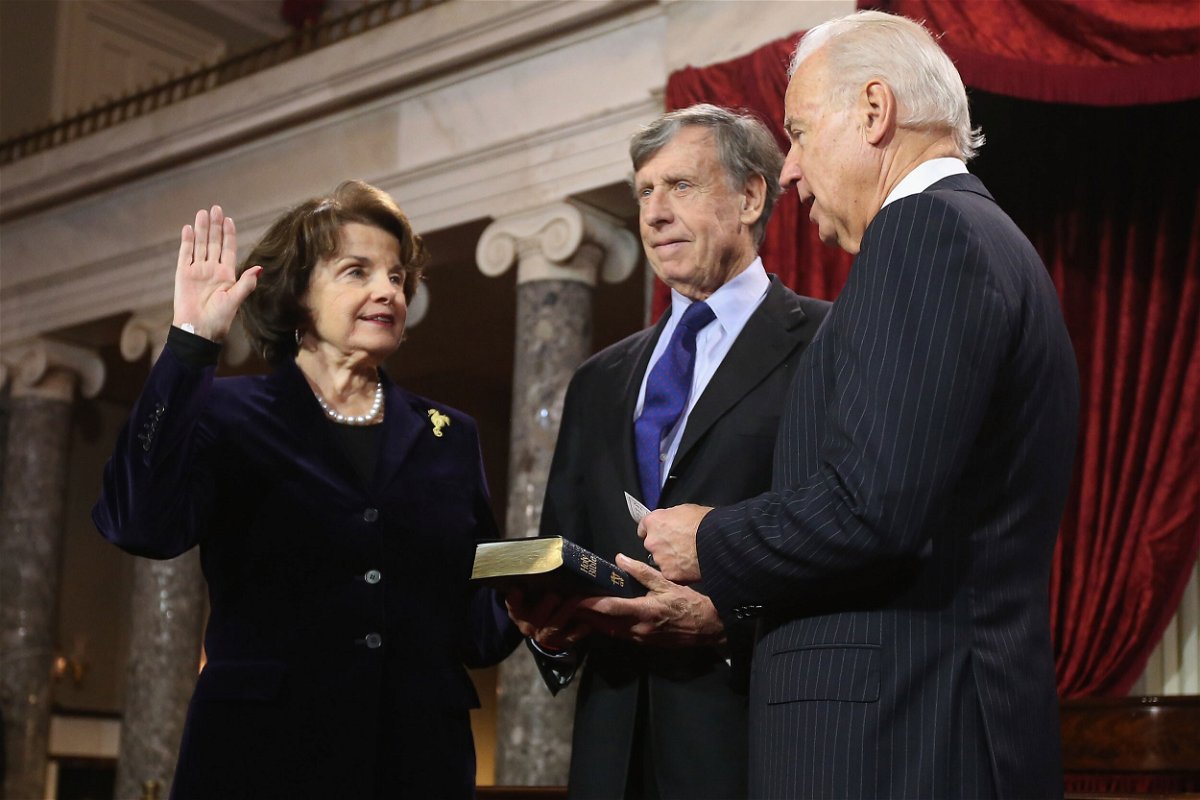<i>Chip Somodevilla/Getty Images</i><br/>Sen. Dianne Feinstein is seen here with her late husband Richard C. Blum and then-Vice President Joe Biden in the Old Senate Chamber at the US Capitol in January 2013 in Washington