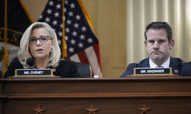 Rep. Liz Cheney and Rep. Adam Kinzinger listen during a committee meeting on Capitol Hill on December 1