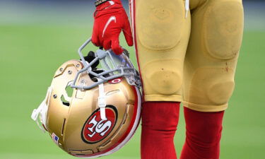 San Francisco 49ers confirm a "network security incident." A ransomware gang claims responsibility. A 49ers player here holds his helmet during the NFL game against the Los Angeles Rams on January 9.