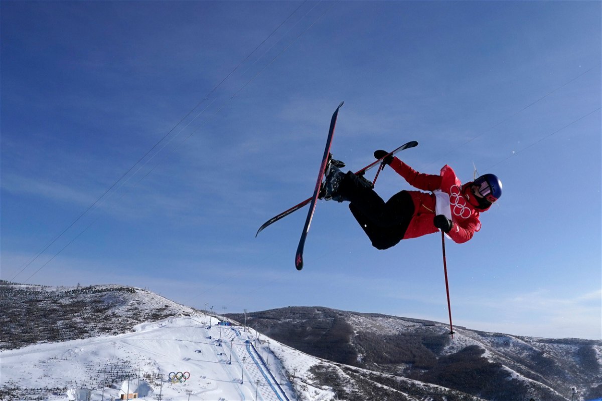 <i>Gregory Bull/AP</i><br/>Gu takes flight during the halfpipe final on February 18.