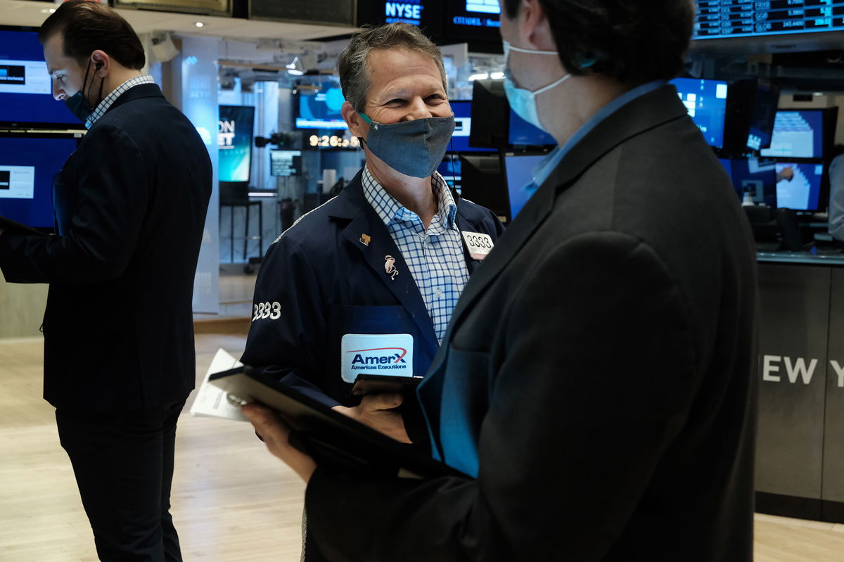 <i>Spencer Platt/Getty Images</i><br/>Traders work on the floor of the New York Stock Exchange (NYSE) on February 4 in New York City.