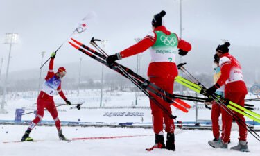 The Russian Olympic Committee celebrates winning the gold medal in the men's cross-country skiing 4x10m relay on Sunday.