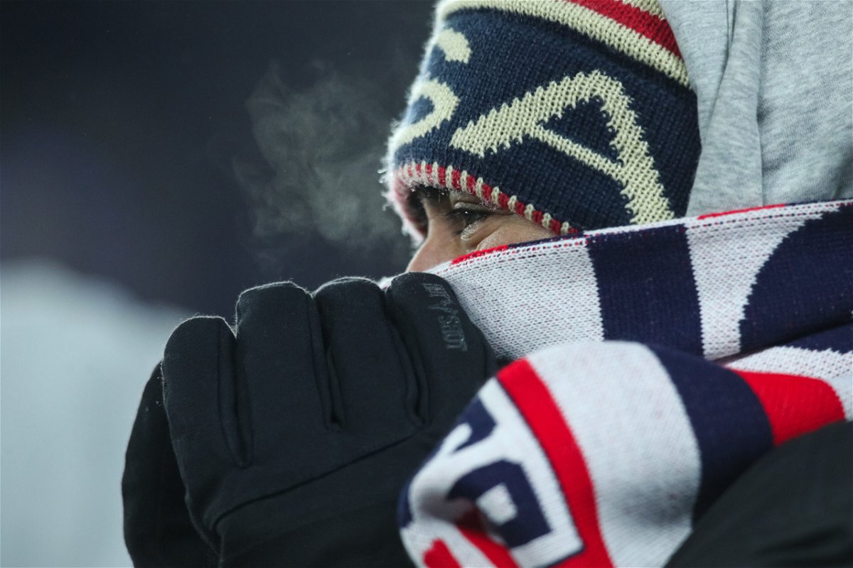 <i>David Berding/Getty Images</i><br/>A fan tries to stay warm during the match.