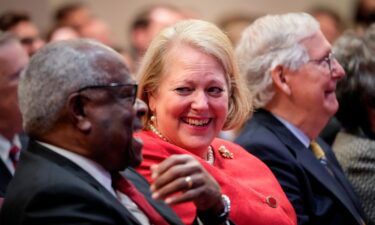 Associate Supreme Court Justice Clarence Thomas sits with his wife and conservative activist Virginia Thomas while he waits to speak at the Heritage Foundation in 2021 in Washington