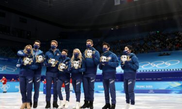 Silver medalists Team USA pose during the team event flower ceremony.