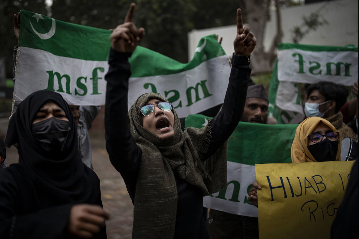 <i>Altaf Qadri/AP</i><br/>Indian Muslim woman shouts slogans during a protest in Delhi against the ban on Muslim girls wearing hijab in class.