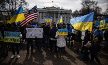 People participate in a pro-Ukrainian demonstration in front of the White House to protest the Russian invasion of Ukraine on February 26 in Washington