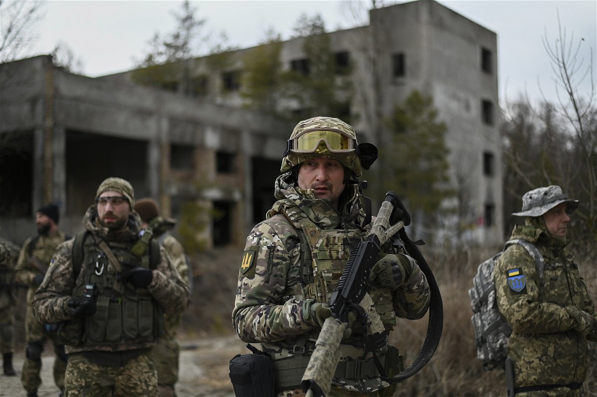 <i>Justin Yau/Sipa USA/AP</i><br/>Ukrainian civilian volunteers and reservists of the Kyiv Territorial Defense unit conduct weekly combat training in an abandoned asphalt factory on February 19