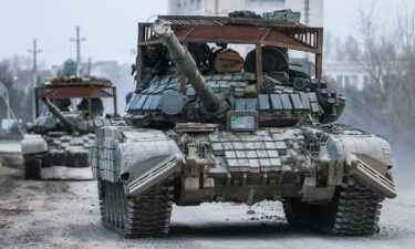 Russian tanks move across the town of Armyansk in northern Crimea.