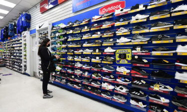 A woman shops for shoes at a sporting goods store in Alhambra