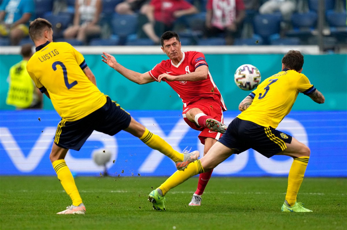 <i>Dmitry Lovetsky/Pool/Getty Images</i><br/>Lewandowski scores against Sweden in their Euro 2020 clash.