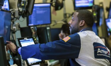 Trader Aaron Ford works on the New York Stock Exchange floor