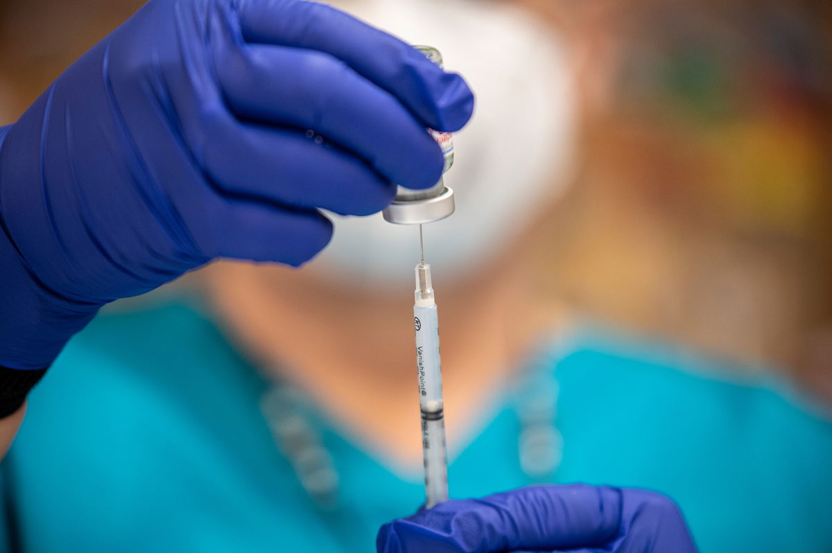 <i>Sergio Flores/Getty Images</i><br/>CDC vaccine advisers vote to recommend FDA-approved Moderna Covid-19 vaccine for adults. Pictured is the Moderna vaccine at a vaccination site on March 29