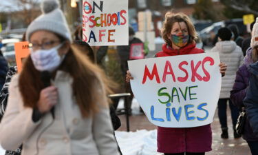 People gather in support of continuing the school mask mandate outside the Loudon County Government Center prior to a Board of Supervisors meeting on January 18