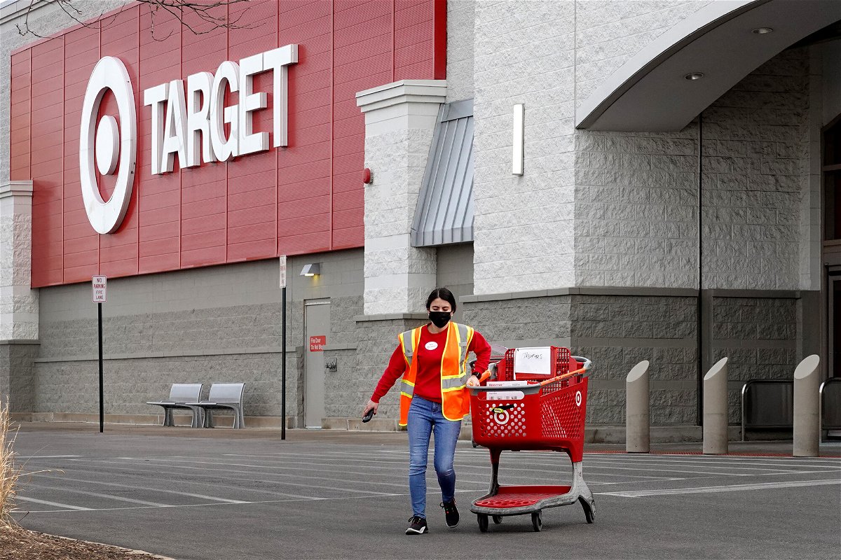 <i>Scott Olson/Getty Images</i><br/>A worker brings merchandise to a customer who opted for pick-up service at a Target store in Chicago.
