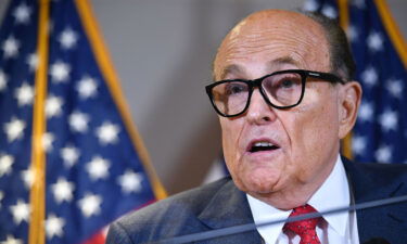 The January 6 committee still expects Rudy Giuliani to "cooperate fully" with its subpoena. Giuliani is seen here in Washington