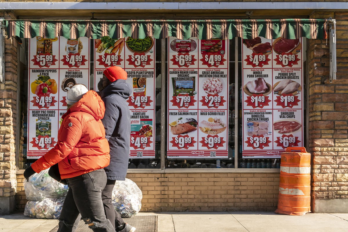 <i>Richard B. Levine/Levine Roberts/ZUMA Press</i><br/>A federal official warns on high inflation. Various sale items are here advertised in the window of a supermarket in New York on February 6.