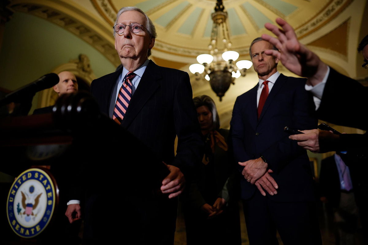 <i>Chip Somodevilla/Getty Images</i><br/>Senate Minority Leader Mitch McConnell (R-KY) talks to reporters with Sen. John Thune (R-SD) and other GOP leaders following the weekly Senate Republican policy luncheon at the U.S. Capitol on December 14