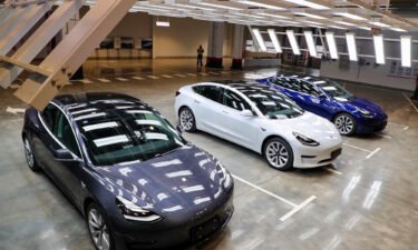 Tesla Model 3 cars are displayed during the Tesla China-made Model 3 Delivery Ceremony in Shanghai.