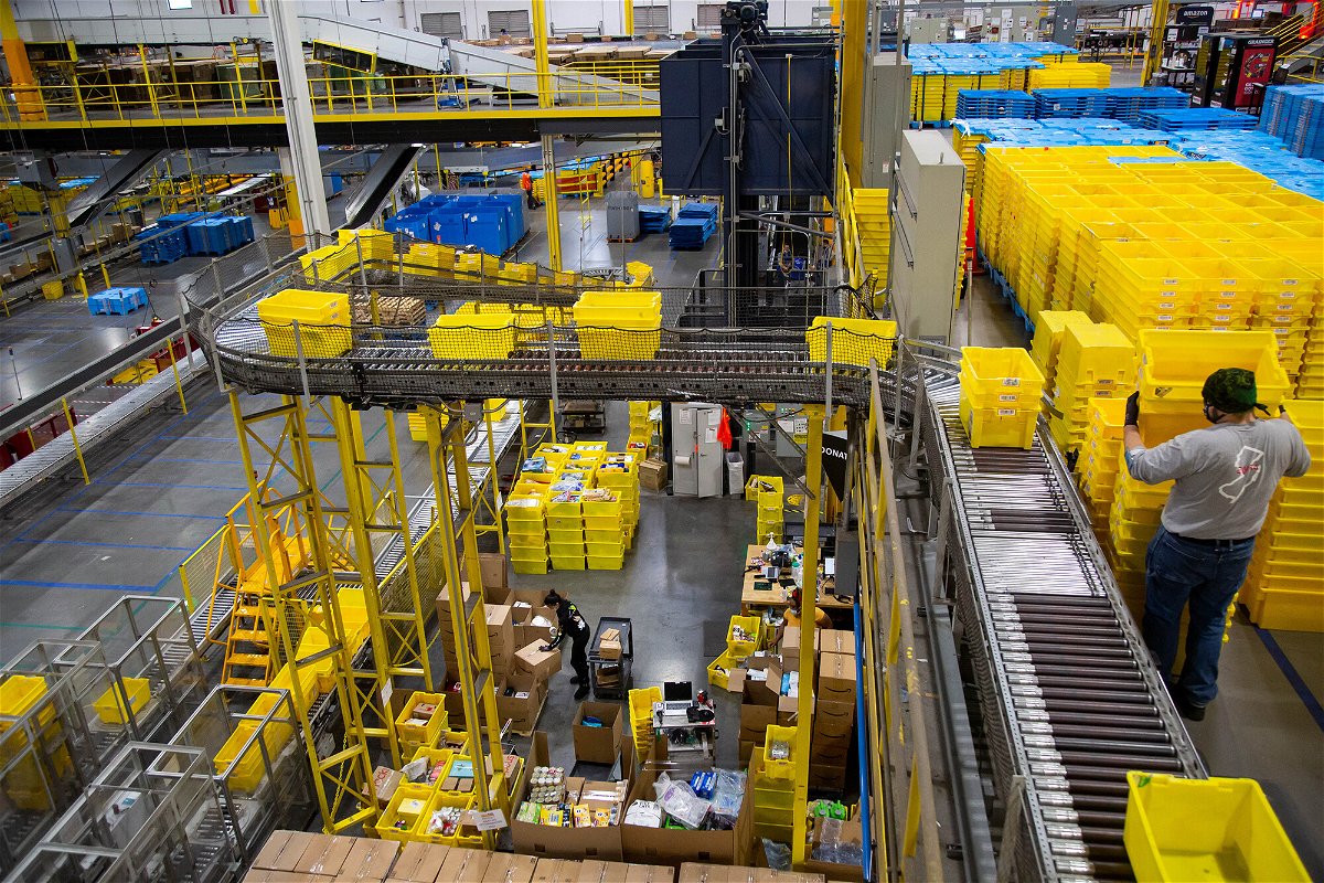 <i>Michael Nagle/Bloomberg/Getty Images</i><br/>Bins move along a conveyor at an Amazon fulfillment center on Cyber Monday in Robbinsville