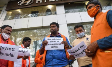 Protestors belonging to Hindu Janajagruti Samiti hold placards during a demonstration staged in front of South Korean automobile manufacturer