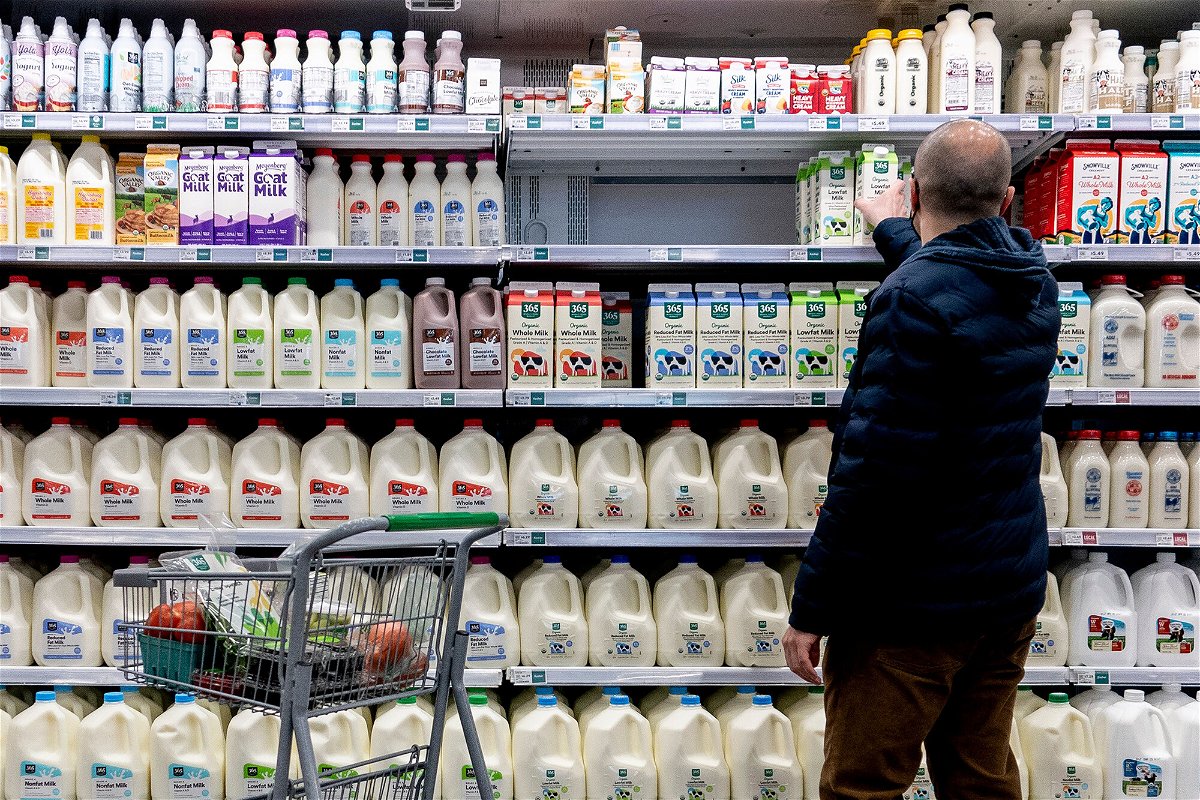 <i>Stefani Reynolds/AFP/Getty Images</i><br/>A shopper walks through the dairy aisle of a grocery store in Washington