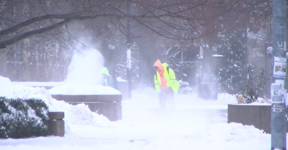 Workers blow snow Thursday, Feb. 3, 2022, in downtown Columbia.