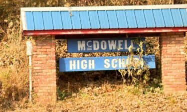 A McDowell County high school teacher who was caught on video using a racial slur in November has returned to the classroom.