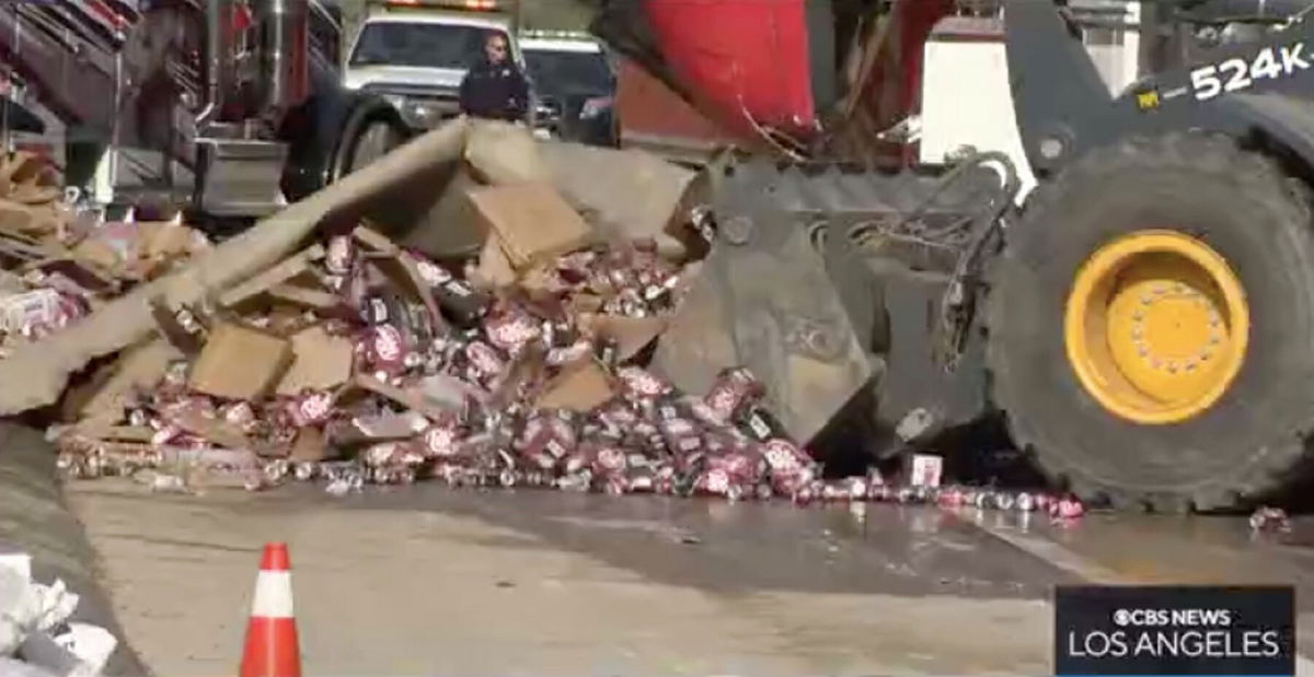 <i>KCAL/KCBS</i><br/>Thousands of Coca-Cola product cans spilled across the I-10 Freeway Saturday morning when a semi truck delivering products to local distributors was involved in a multi-vehicle collision.