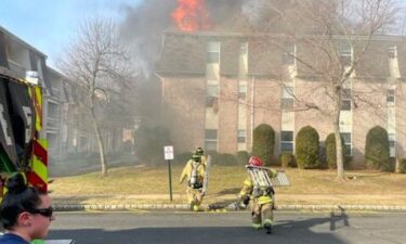 1st responders catch baby tossed from burning apartment complex in New Jersey.