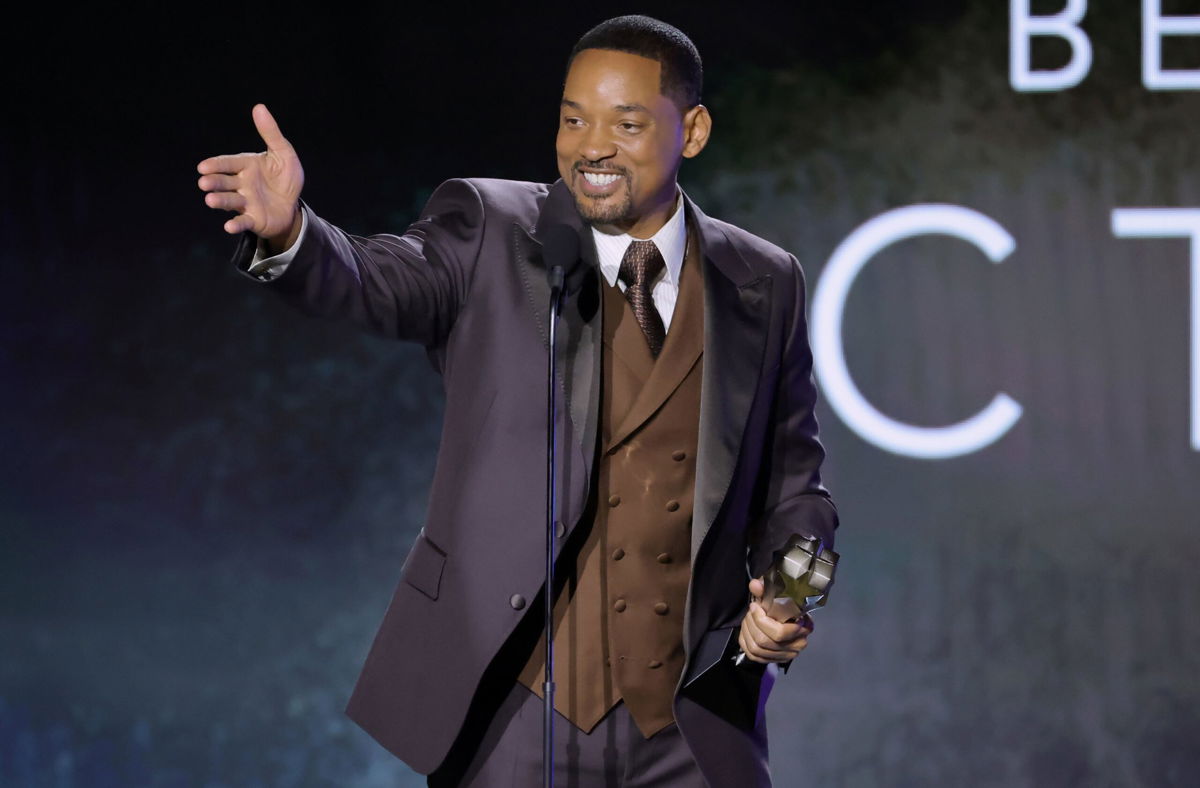 <i>Amy Sussman/Getty Images</i><br/>Will Smith accepts a best actor award for his role in the film 