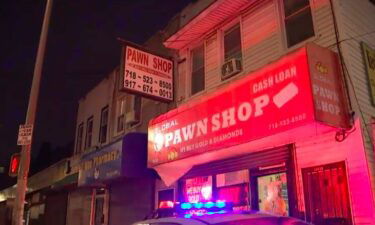 An owner of a pawn shop in Queens was struck in the in the head with a metal rod during a robbery inside the store Monday afternoon.