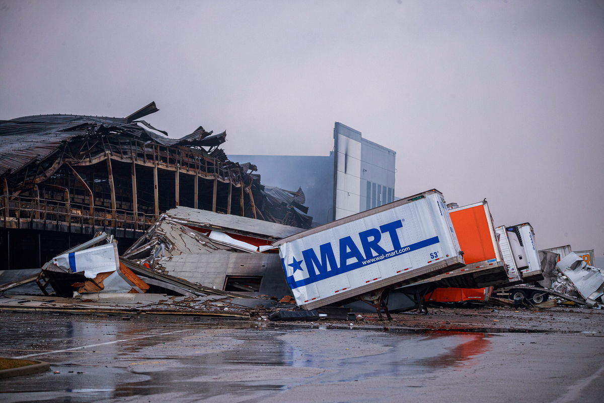 <i>Jeremy Hogan/SOPA Images/Shutterstock</i><br/>Burned semi-trailers are seen after a fire at a Walmart distribution center in Plainfield