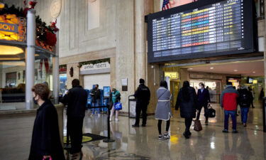 Commuters walk through Newark Pennsylvania Station in Newark