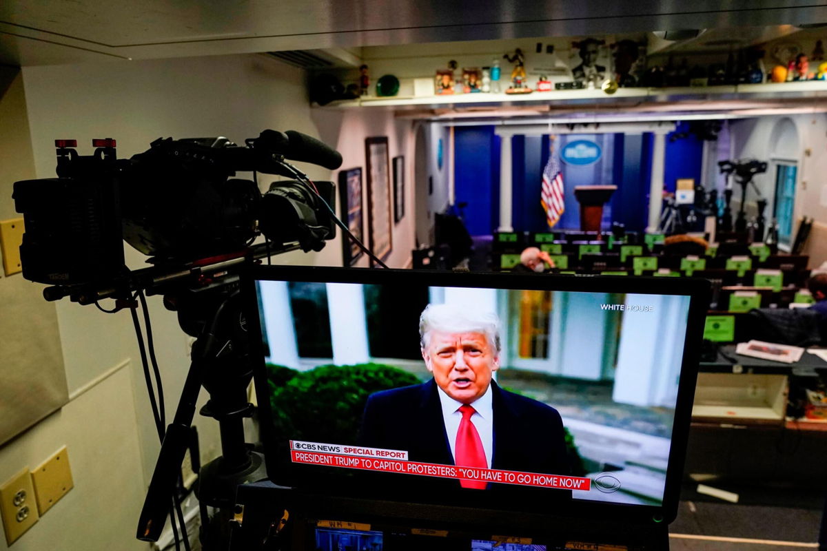<i>Joshua Roberts/Getty Images</i><br/>U.S. President Donald Trump is shown speaking on a monitor in the White House briefing room about the violence during the ratification of the 2020 election on January 6