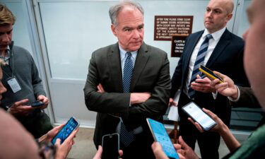 Sen. Tim Kaine speaks with reporters in the Senate Subway at the US Capitol in January 2020 in Washington