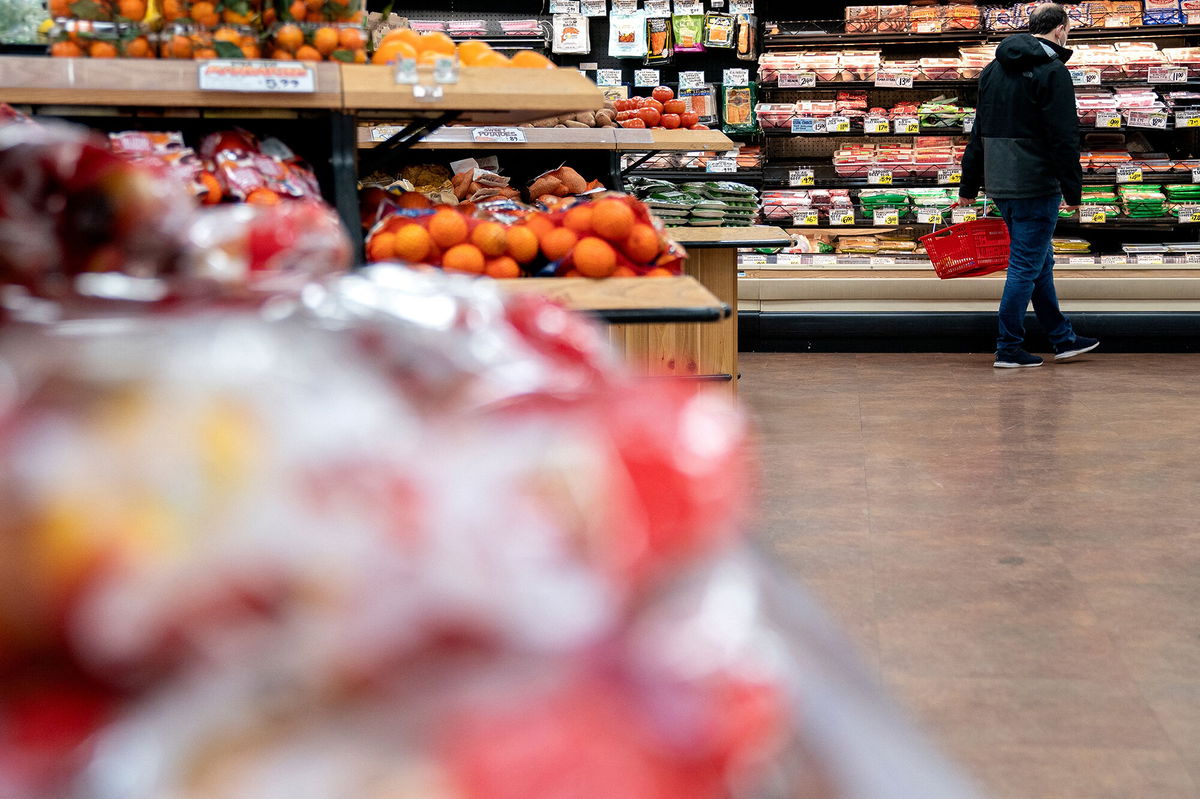 <i>Stefani Reynolds/AFP/Getty Images</i><br/>A shopper walks through a grocery store in Washington