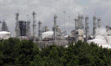 The Justice Department has secured a settlement with the chemical company Chevron Phillips to make upgrades at three of its Texas petrochemical plants amid allegations that it violated the Clean Air Act and state air pollution control laws. The Chevron Phillips Cedar Bayou petrochemical plant is shown here in 2005.