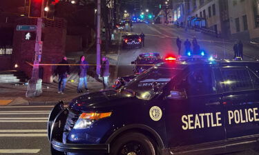 Officers were responding to calls reporting gunshot sounds when they found a man who had crashed into a federal building