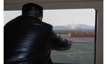 Kim Jong Un is shown watching a missile launch