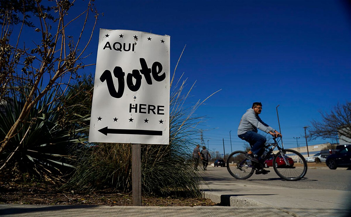 <i>Eric Gay/AP</i><br/>Voters leave an early voting poll site February 14 in San Antonio. Texas kicks off the 2022 midterm elections March 1 with the nation's first primaries.