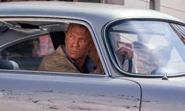 James Bond (Daniel Craig) and Dr. Madeleine Swann (Léa Seydoux) drive through Matera
