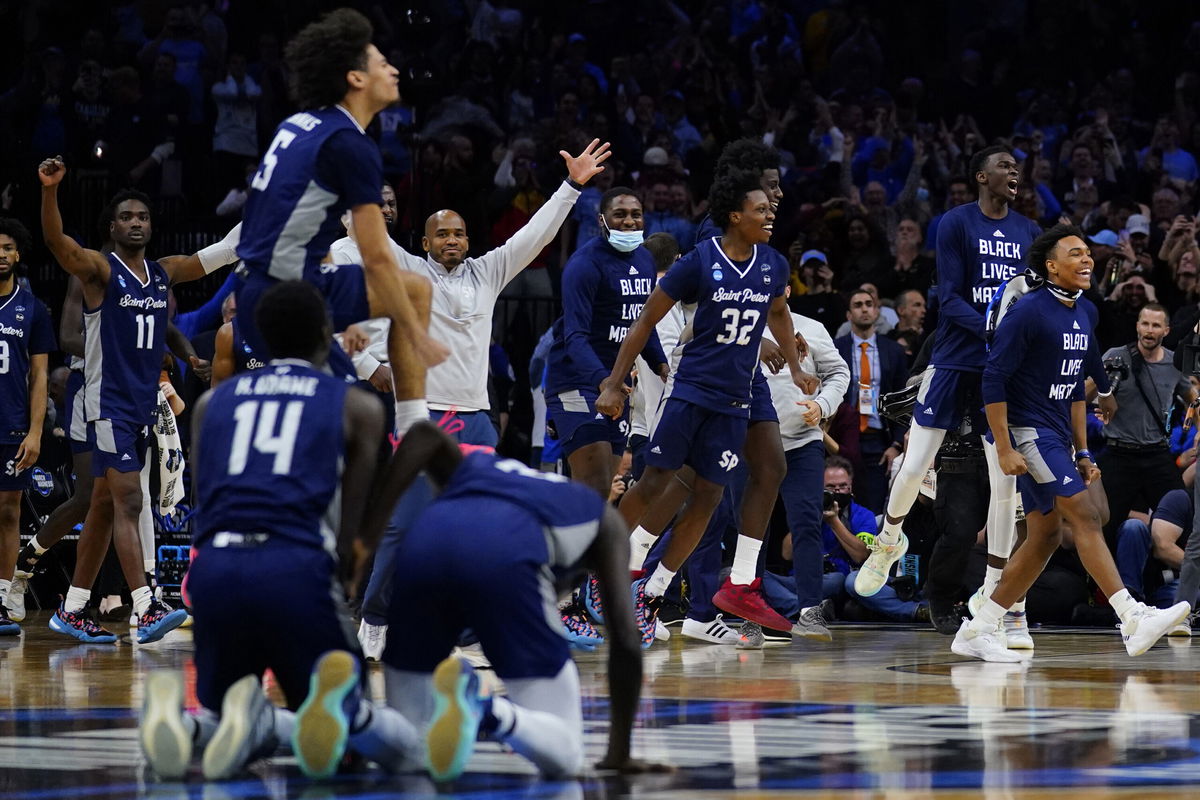 <i>Matt Rourke/AP</i><br/>Saint Peter's celebrates after winning a college basketball game against Purdue in the Sweet 16 round of the NCAA tournament