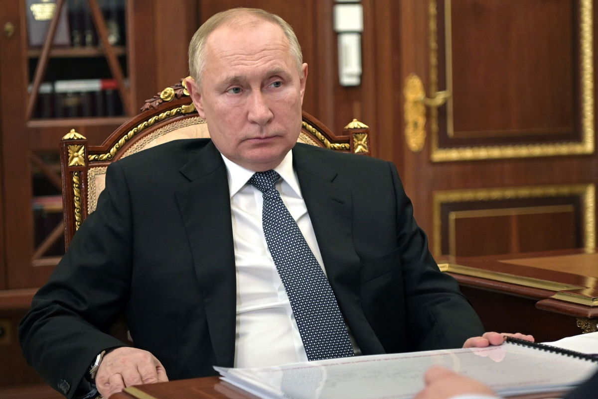 <i>MIKHAIL KLIMENTYEV/AFP/SPUTNIK/Getty Images</i><br/>Russian President Vladimir Putin attends a meeting in Moscow on March 22. Russia's stock market reopened on March 24 after it was shuttered for a month.