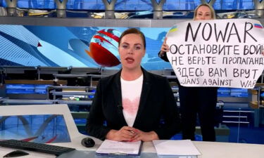 A woman holding a sign reading "NO WAR" interrupted a live news broadcast on Russian state television on March 14 to denounce Russia's invasion of Ukraine.