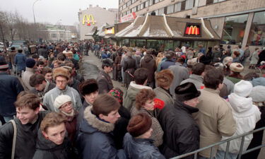 Hundreds of people line up around the first McDonald's restaurant in the Soviet Union at Moscow's Pushkin Square