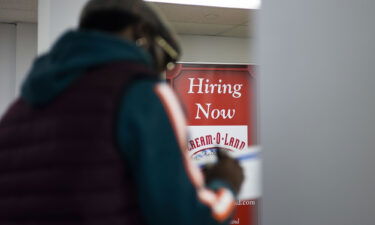 A man fills out a job application during a job fair in Jersey City