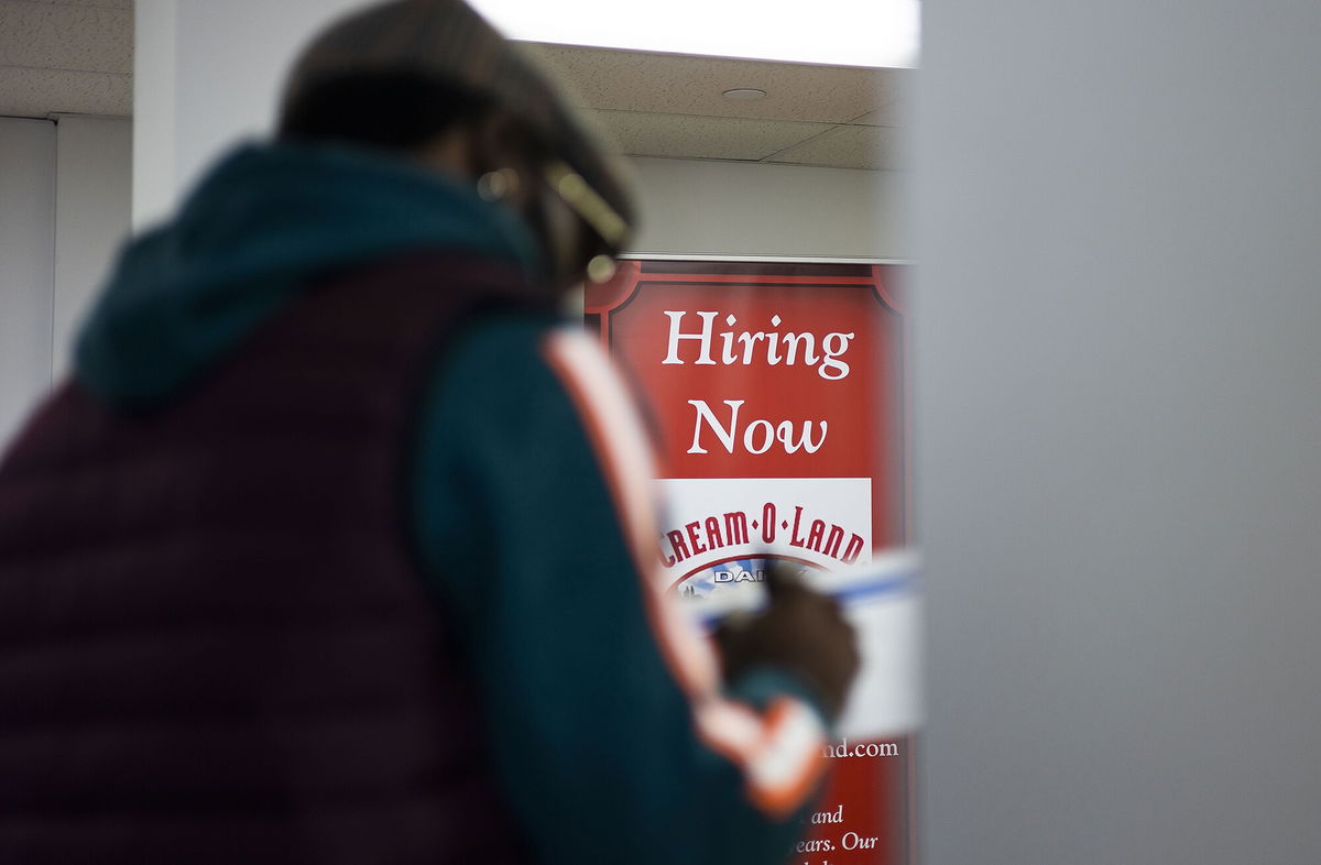 <i>Justin Lane/EPA-EFE/Shutterstock</i><br/>A man fills out a job application during a job fair in Jersey City