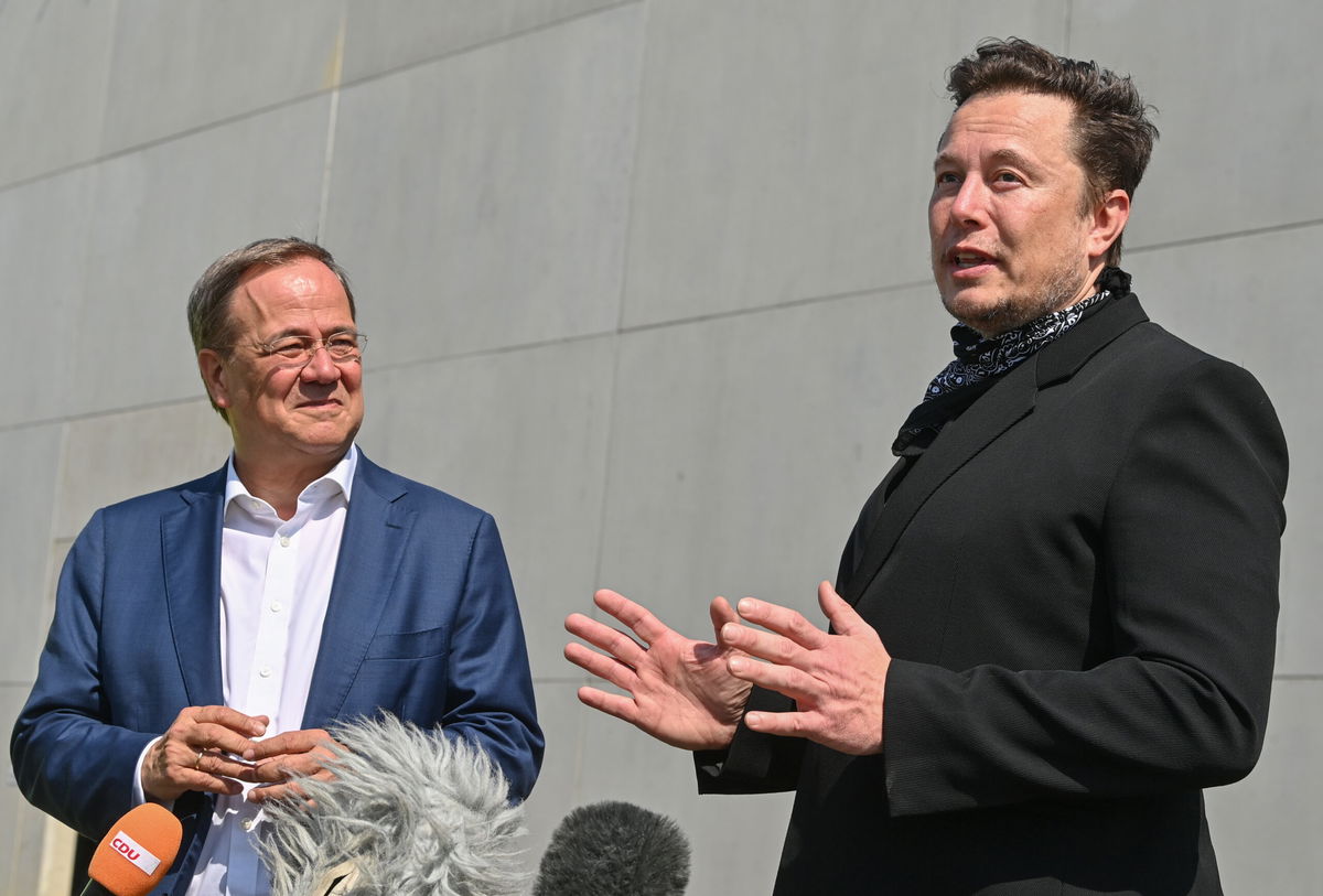 <i>Patrick Pleul/Pool/Getty Images</i><br/>Tesla CEO Elon Musk (R)